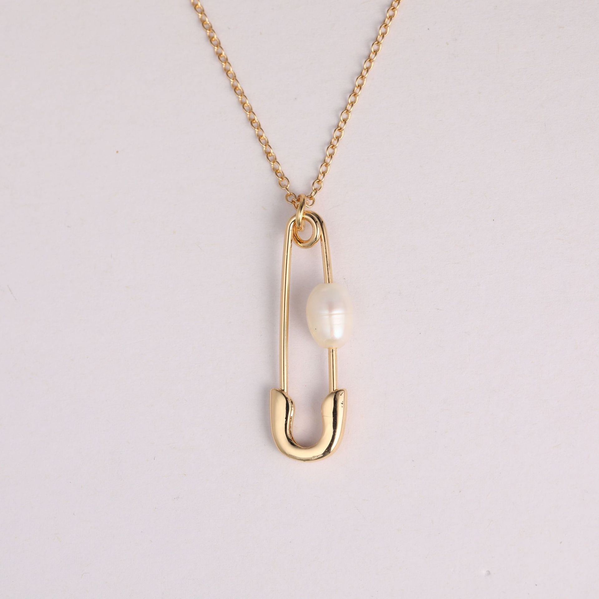 Elegant Gold Safety Pin Necklace with Pearl Accent Stella Harte